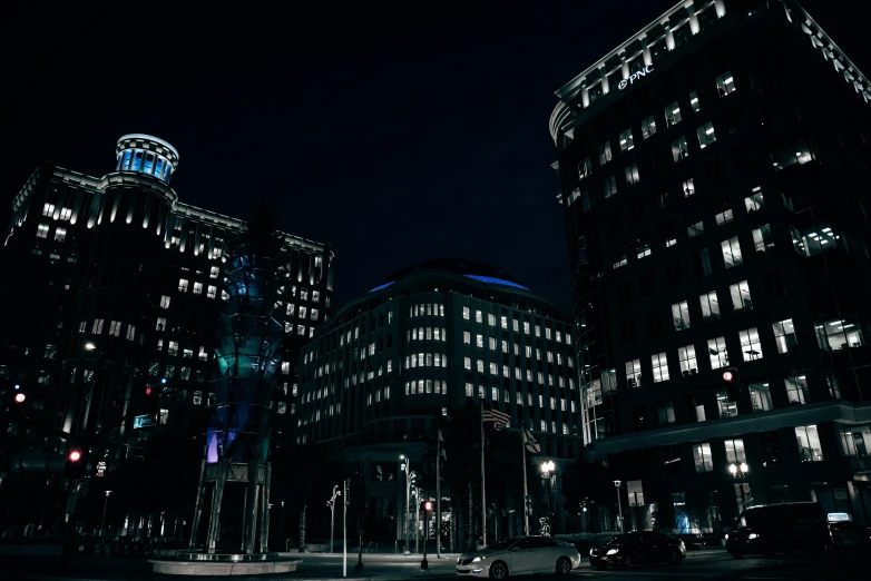 a nighttime view of buildings with lights on