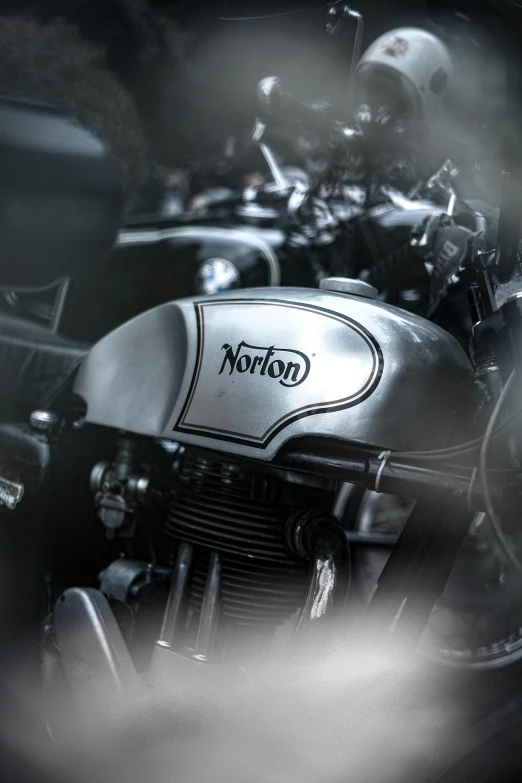 a black and white photo of a motorcycle, a photo, by John Nicolson, trending on unsplash, photorealism, heart emblem on chest, classic cars, neutron, metalic reflection
