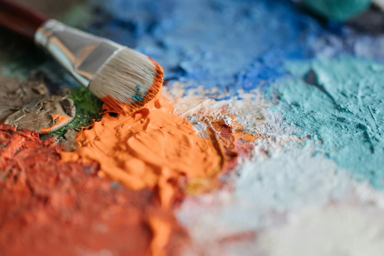 a close up of a paint palette with a brush, inspired by artist, trending on pexels, visual art, blue and orange, multi - coloured