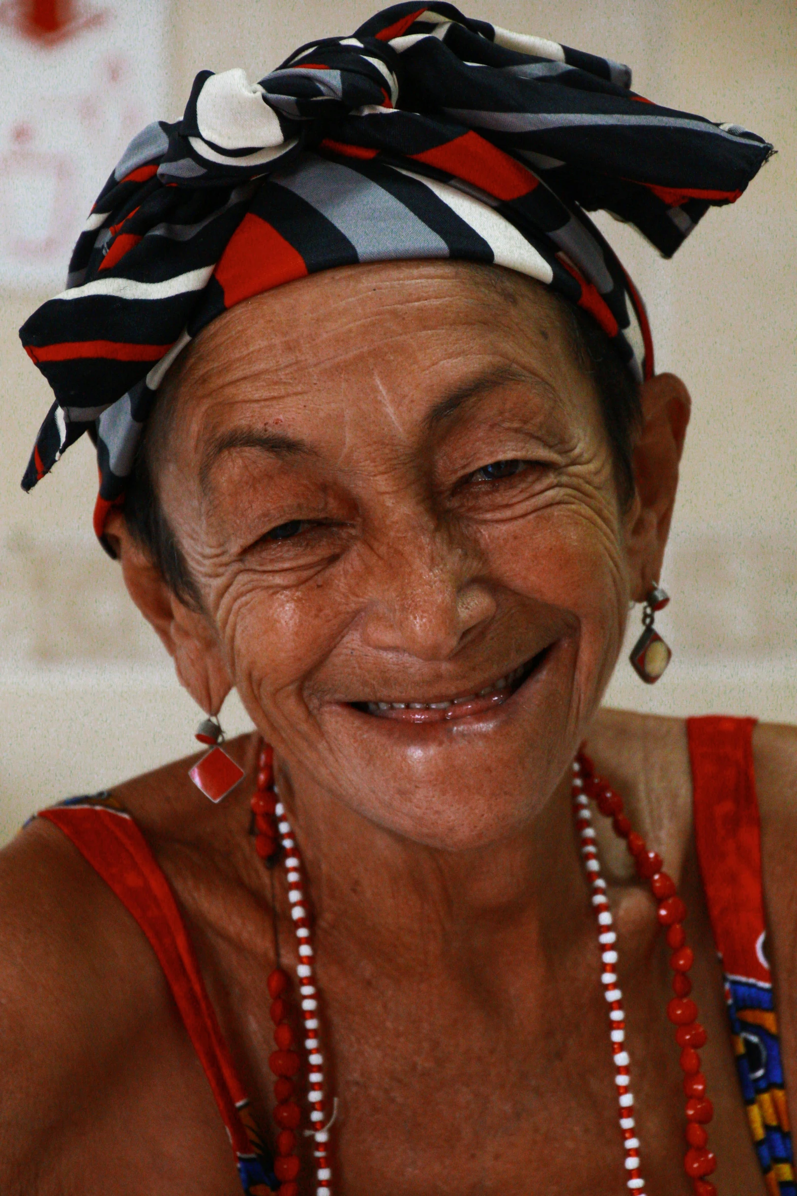 a woman sitting at a table with a plate of food, a portrait, by Juan Giménez, flickr, wrinkly forehead, large smile, rum, polka dot