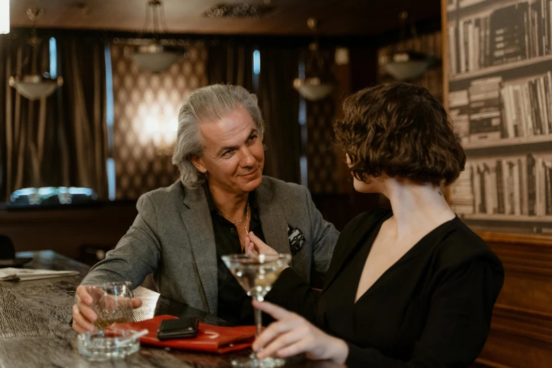 a man and a woman sitting at a bar, pexels contest winner, a silver haired mad, gentlemens dinner, thumbnail, lachlan bailey