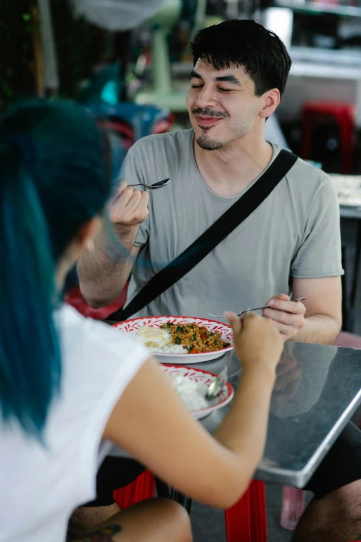 a man and a woman sitting at a table eating food, patiphan sottiwilaiphong, profile image, jacksepticeye, street photo