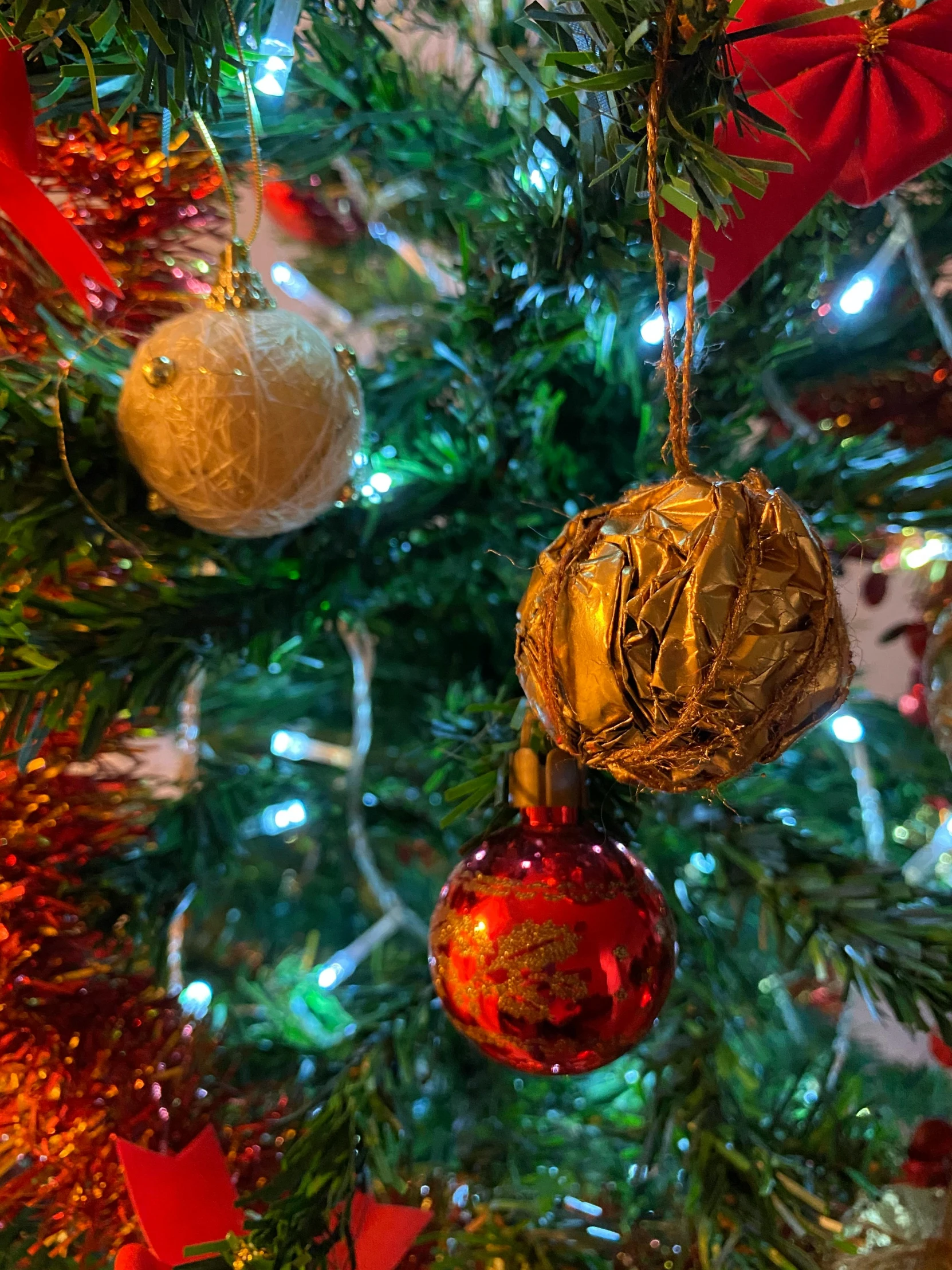 a close up of a christmas tree with ornaments, a picture, inspired by Ernest William Christmas, pexels, happening, taken on iphone 1 3 pro, 8 k detail, 15081959 21121991 01012000 4k, pov photo