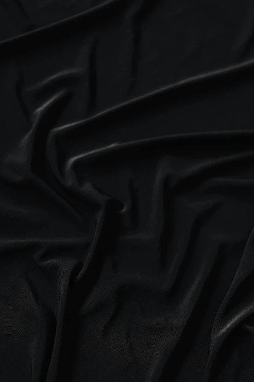 the black background of a silk material