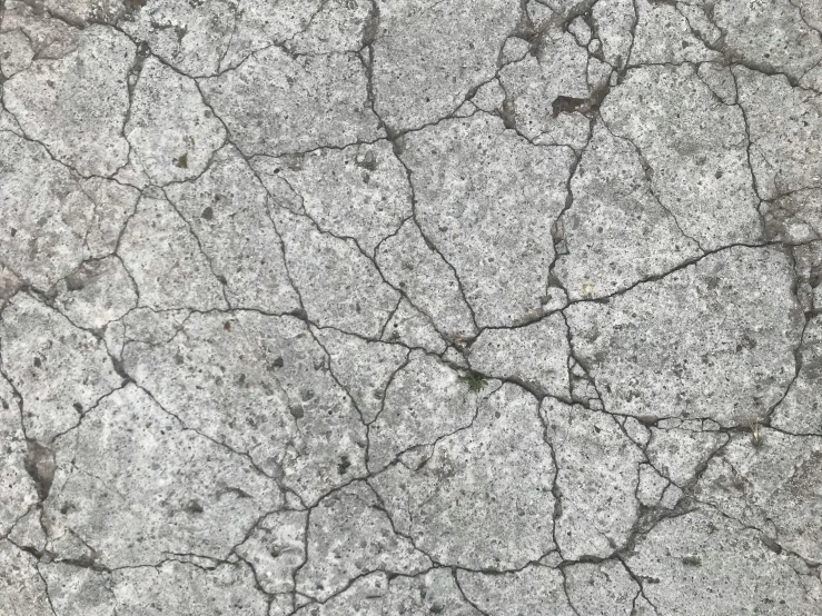 a black and white photo of cracked concrete, pbr texture, tileable, detailed street, background image