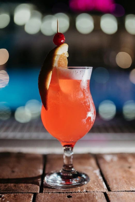 a drink sitting on top of a wooden table, profile image