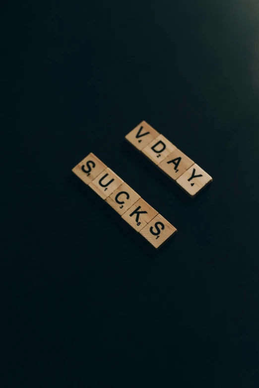 a couple of scrabbles sitting on top of a table, an album cover, trending on unsplash, verdadism, x - day, suicide, vd, blocks