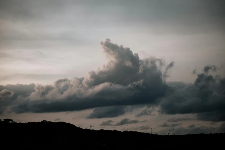 a black and white photo of a cloudy sky, pexels contest winner, surrealism, pink and grey clouds, late afternoon lighting, spaceships in the cloudy sky, landscape photo