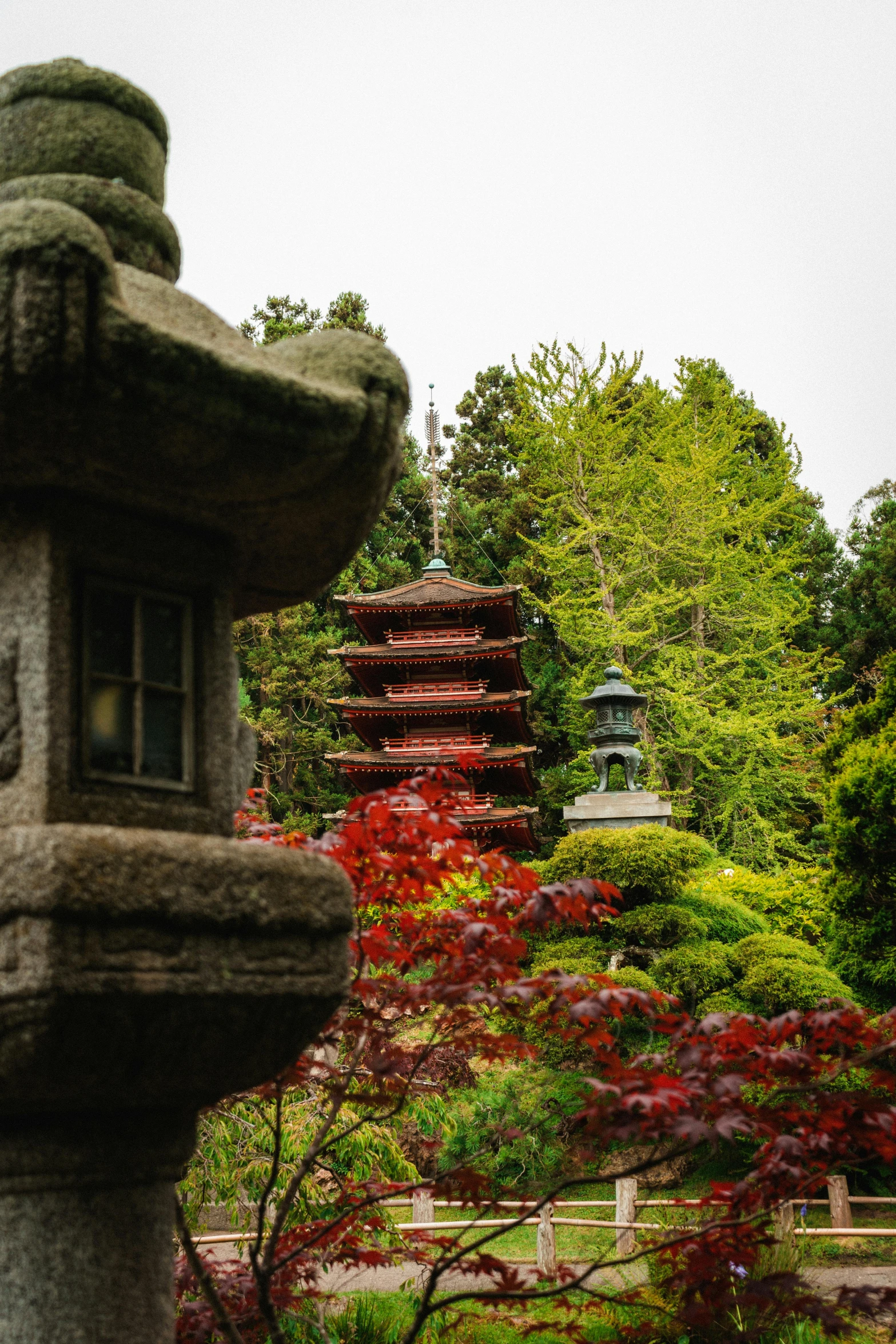 the statue is in front of many beautiful trees