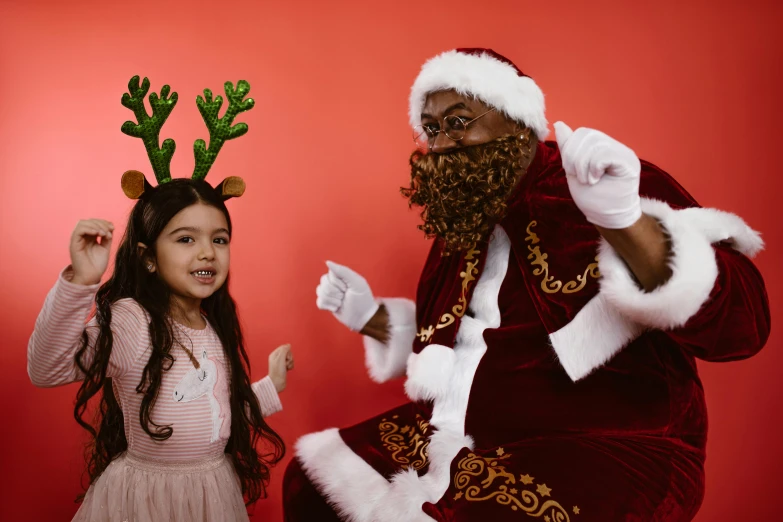 a girl looks at santa clause in her hands