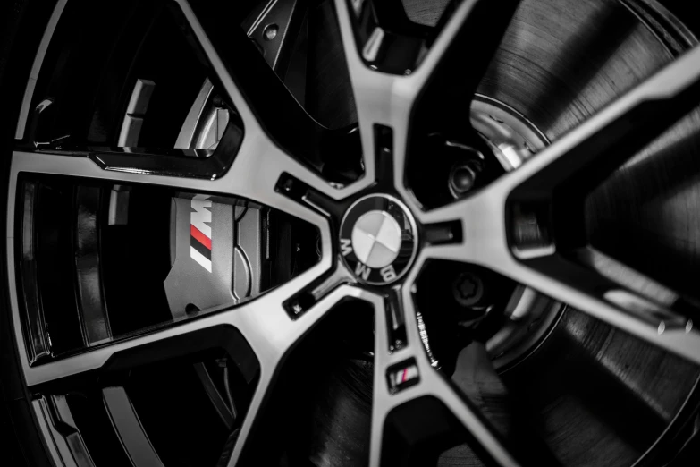 a close up of a wheel on a car, black and white and red, inspect in inventory image, bmw, f18