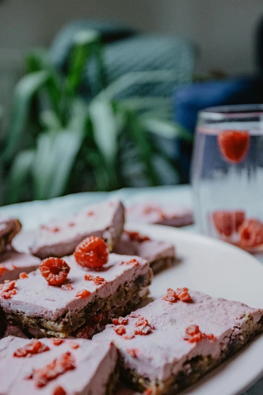 a close up of a plate of food on a table, a picture, unsplash, happening, raspberry, soft grey and red natural light, drinks, cake