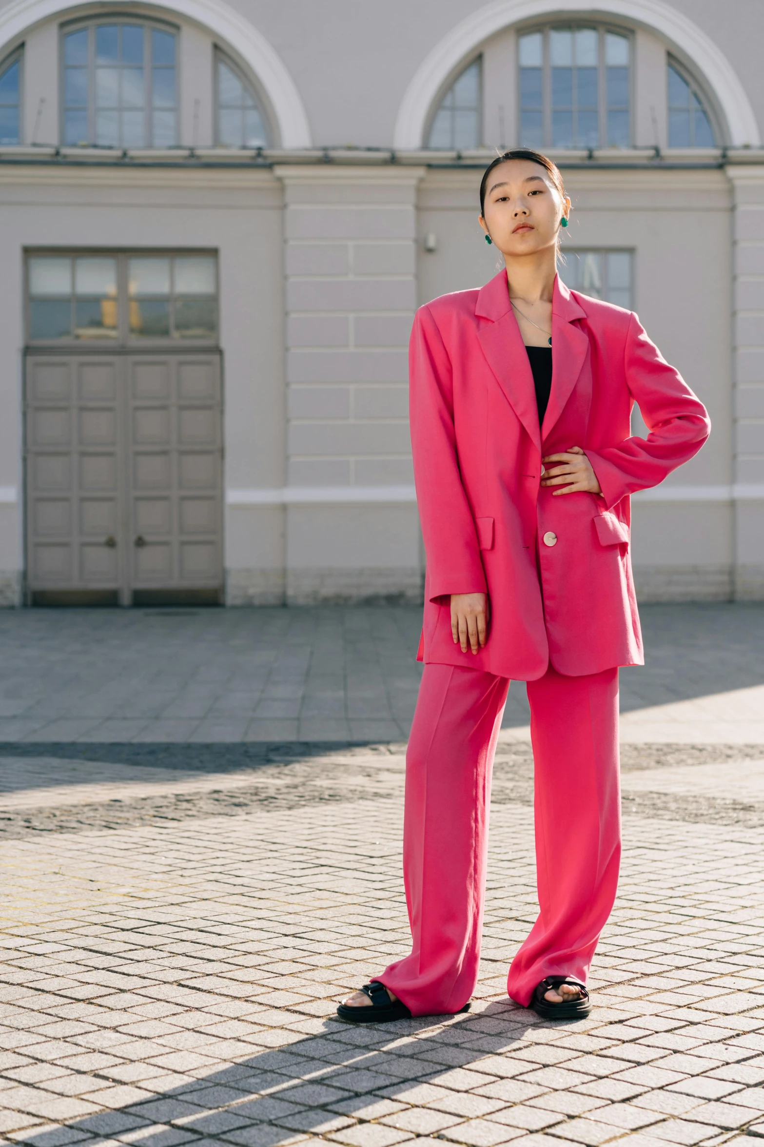 a woman in a pink suit standing in front of a building, by Emma Andijewska, bae suzy, 15081959 21121991 01012000 4k