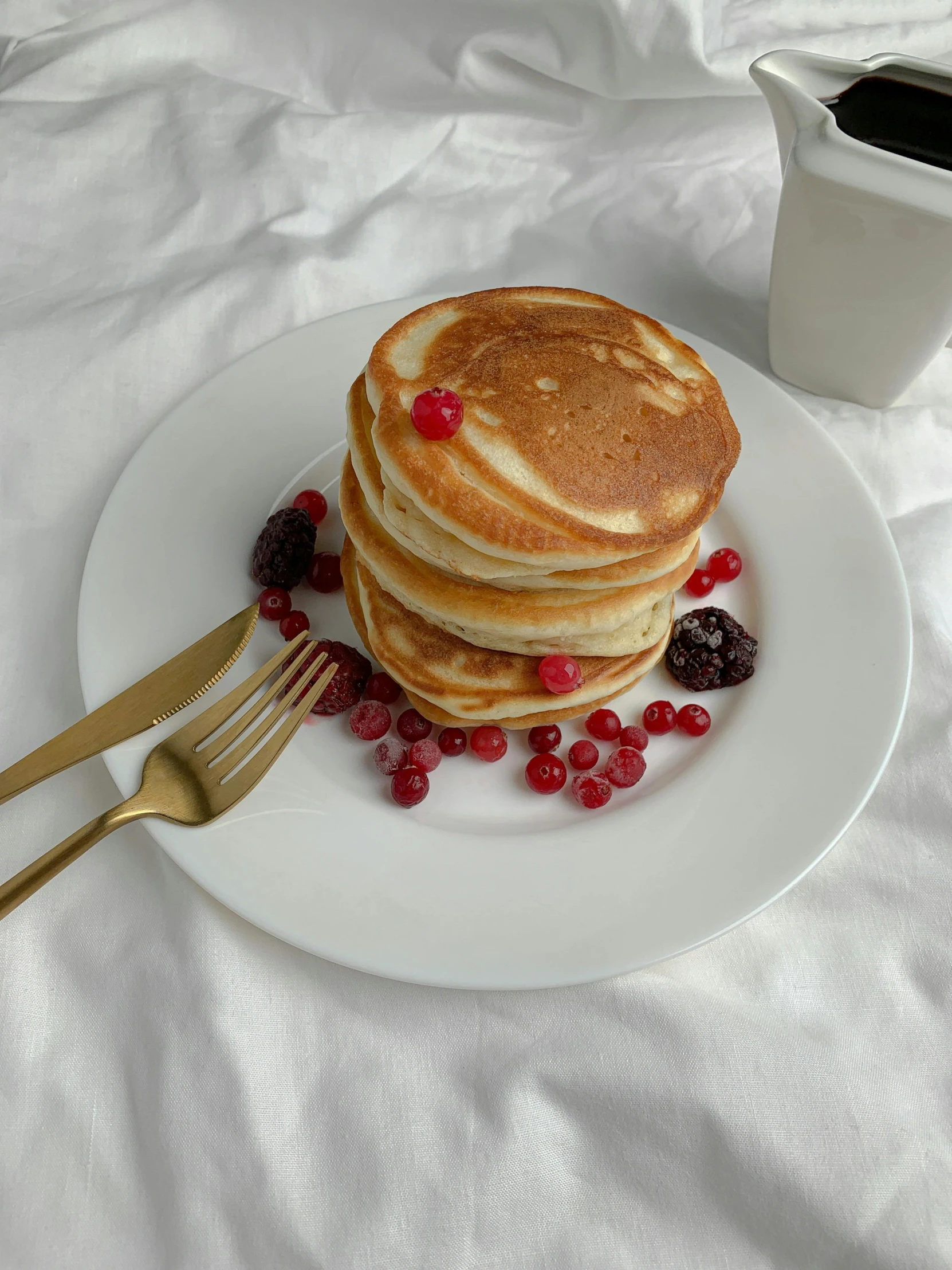 a stack of pancakes sitting on top of a white plate, by Eleanor Best, trending on pexels, malaysian, maroon, soft morning light. hyperrealism, instagram story