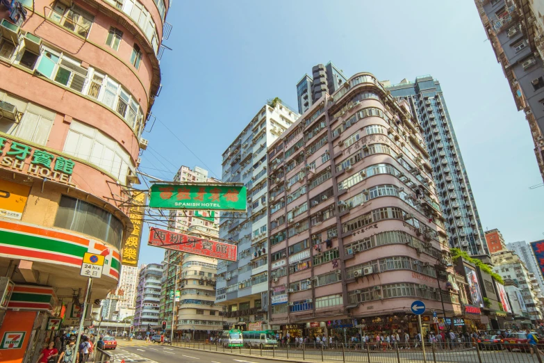 a city street filled with lots of tall buildings, by Patrick Ching, pexels contest winner, art nouveau, kowloon walled city style, rounded architecture, pastel', street corner