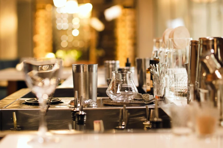 a table topped with lots of silverware and drinks