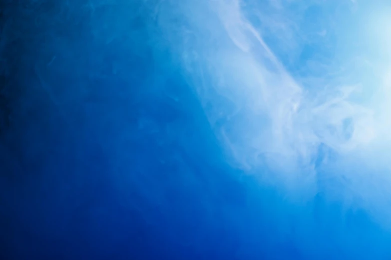 a man flying through the air while riding a snowboard, inspired by Cleve Gray, unsplash, conceptual art, blue translucent resin, background image, background ( smoke, underwater looking up