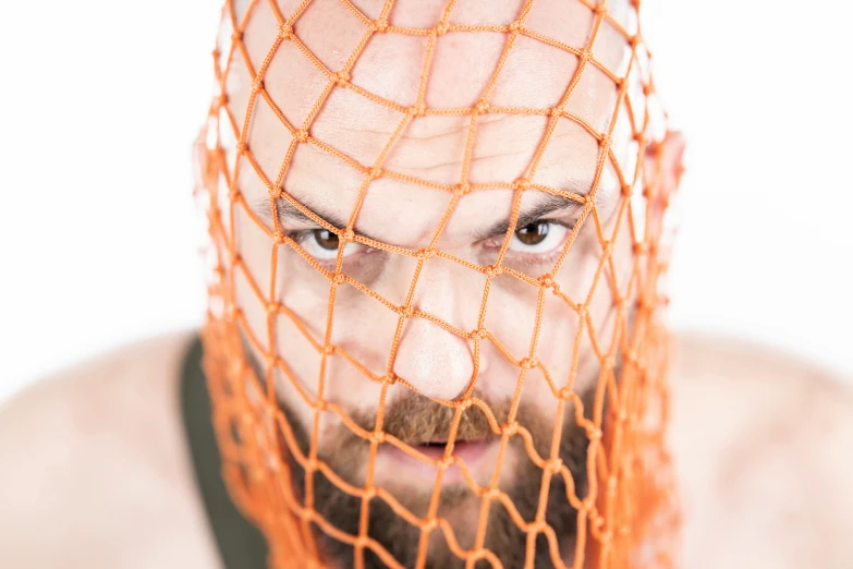 a man with an orange net covering his face, a portrait, flickr, net art, wrestler, goatee beard, headshot profile picture, beskinski