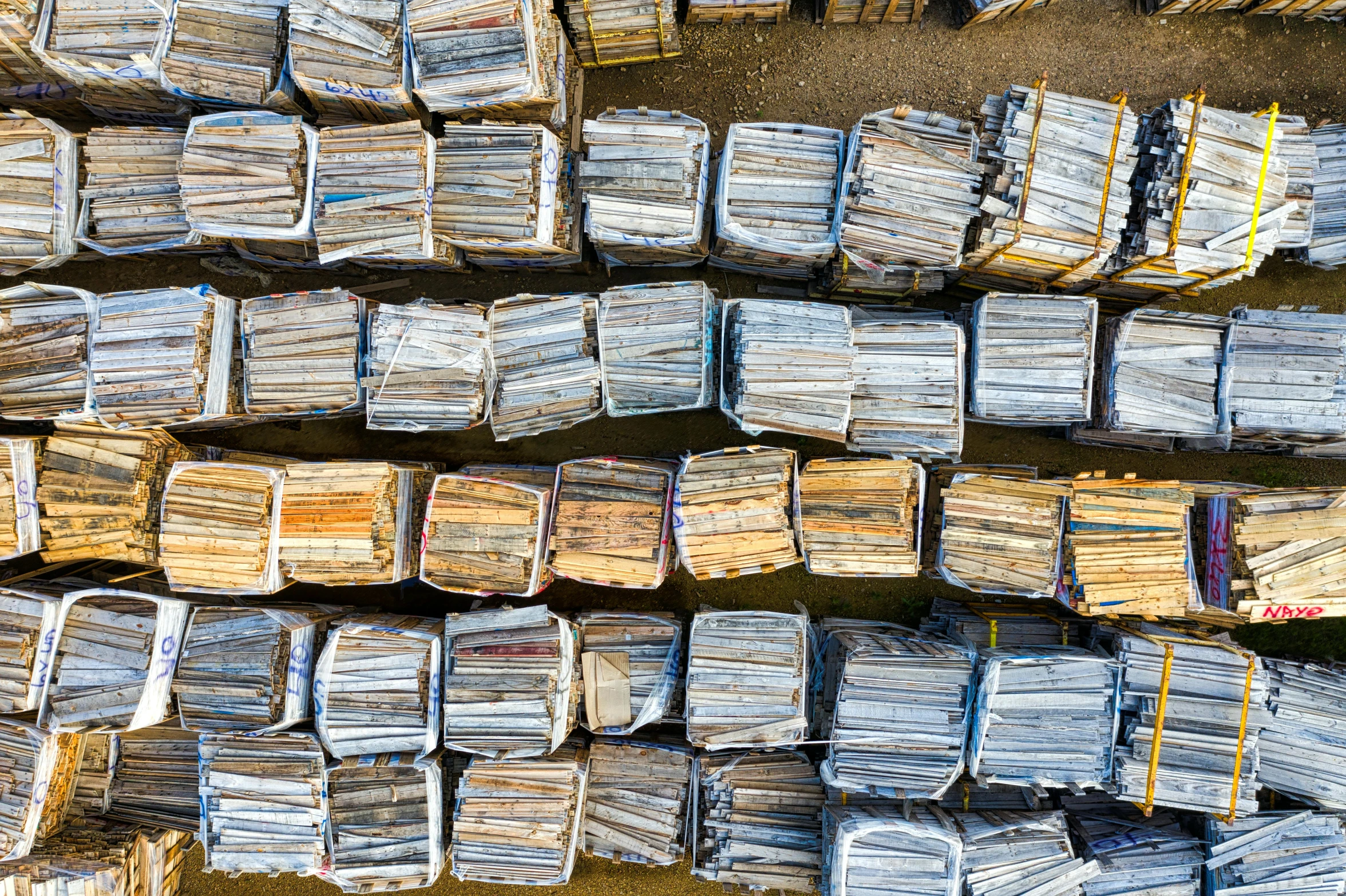 stacks of newspapers stacked on top of each other, an album cover, by Daniel Lieske, unsplash, plasticien, aerial photo, scrapyard, 15081959 21121991 01012000 4k, 4 0 0 0 samples