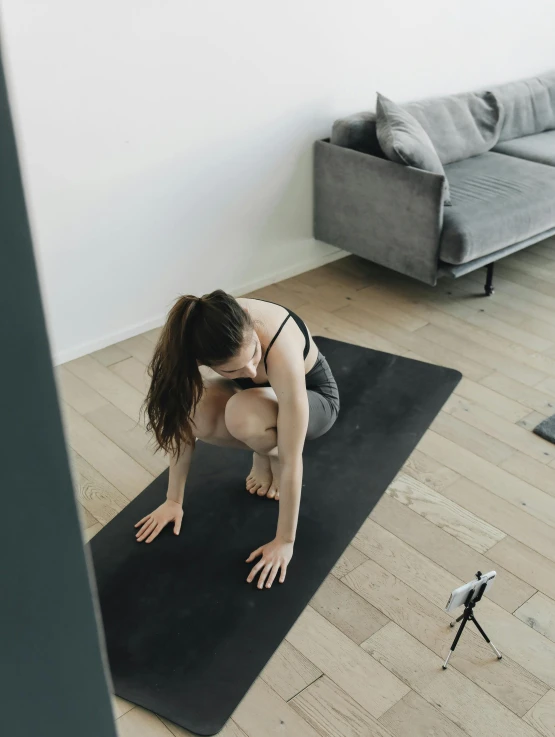 a woman standing on her head doing yoga