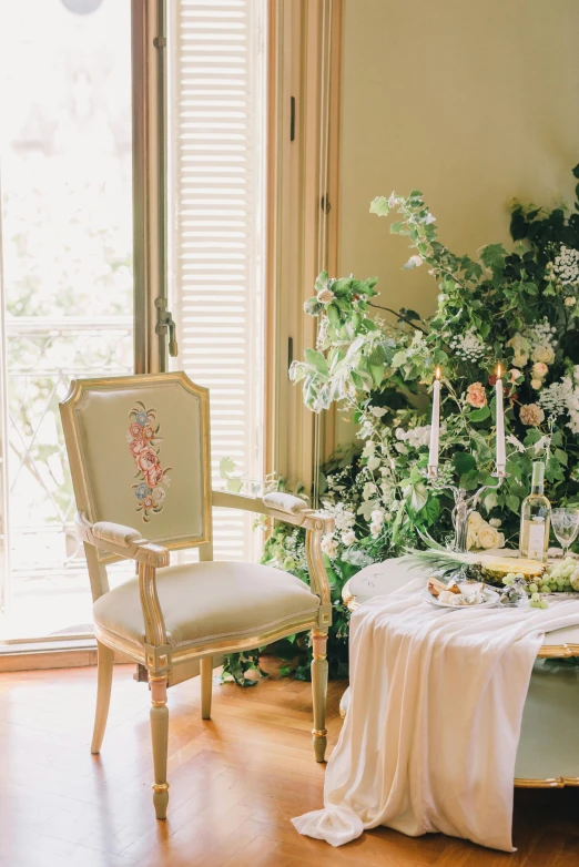 a table in front of a plant in a room