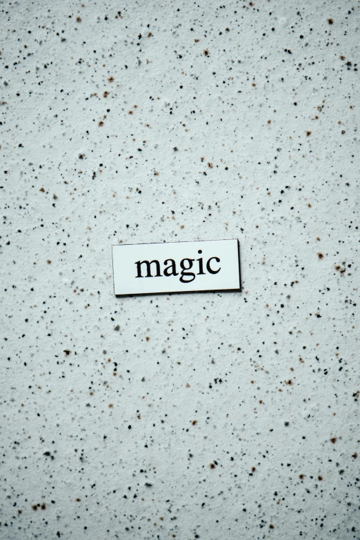 a piece of paper with the word magic on it, unsplash contest winner, magnetic, enamel, 2 0 0 0 s, magic