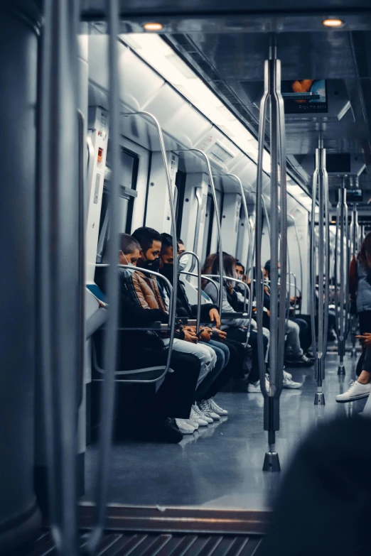 people sitting on the train, and standing up