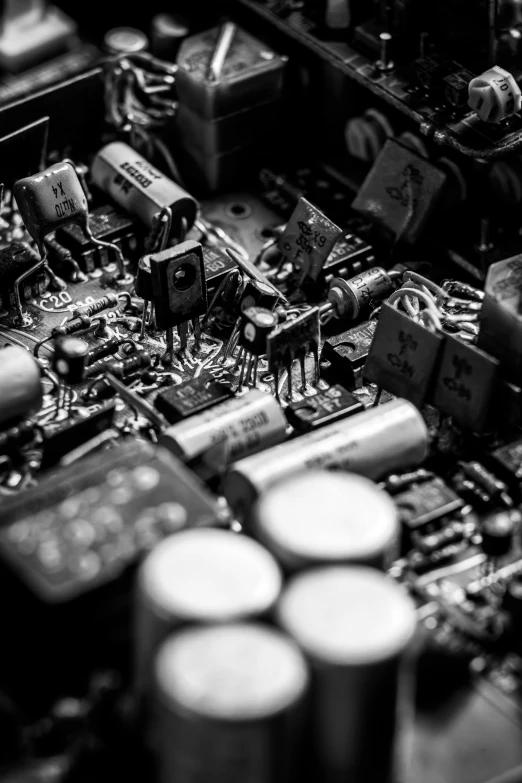 a black and white photo of electronic components, an album cover, by Jacob Toorenvliet, unsplash, detailed innards, retro machinery, hifi, electronic