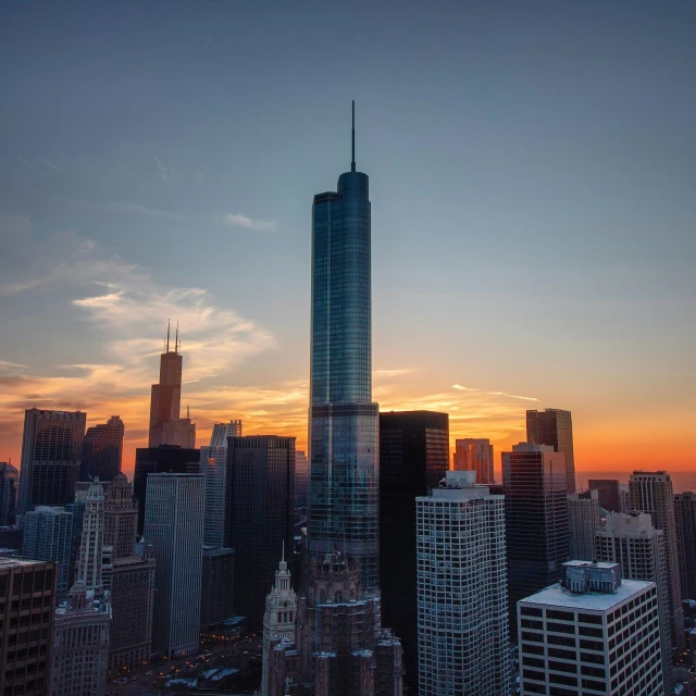 a view of a city at sunset from the top of a building, chicago skyline, trump tower, award - winning photo ”