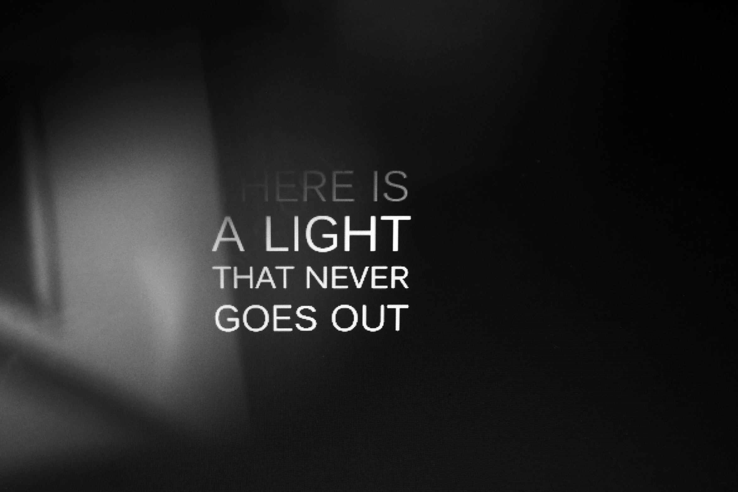 a black and white po with the text there is a light that never goes out