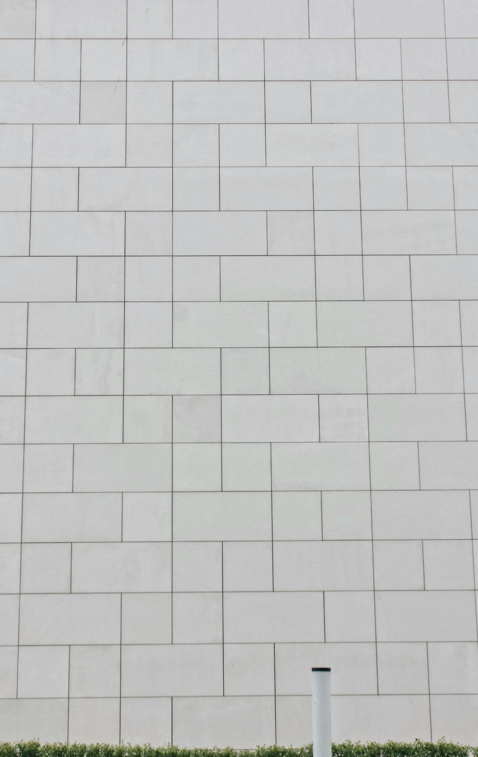 a white wall with an open area between the two sides