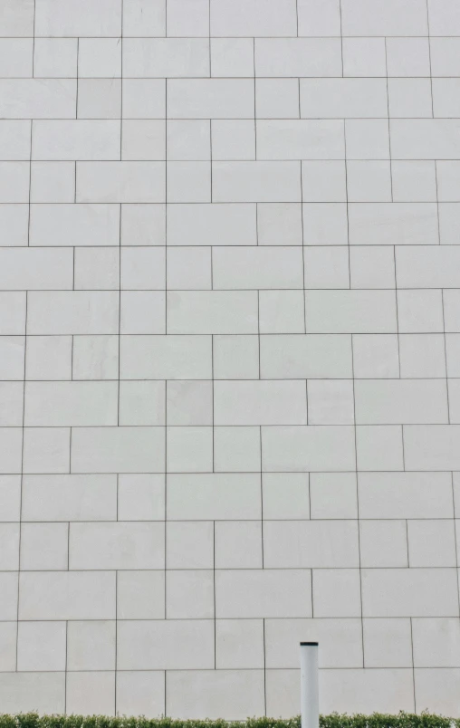 a white wall with an open area between the two sides