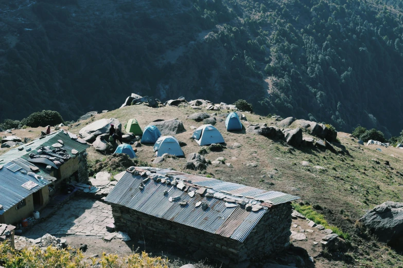 a group of tents sitting on top of a mountain, les nabis, profile image, hut, high view, no crop