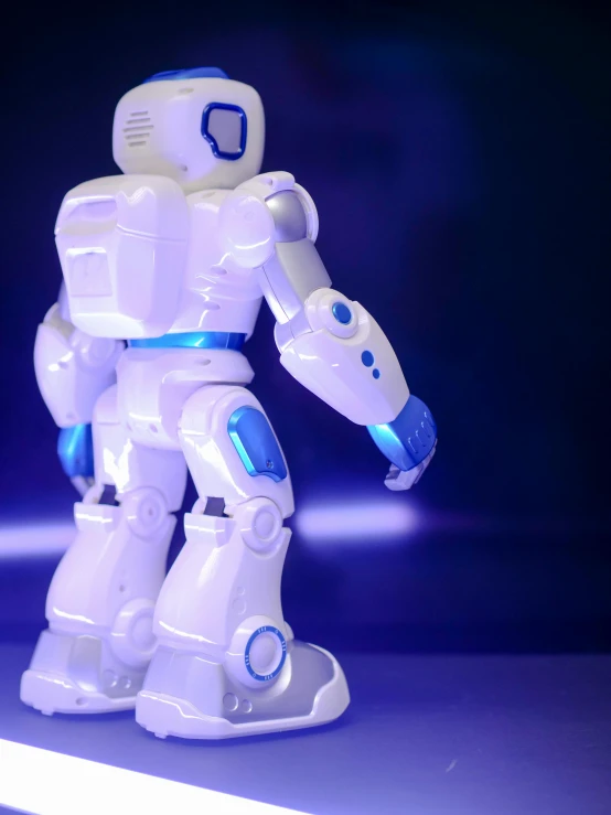 a close up of a toy robot on a table, a hologram, unsplash, 15081959 21121991 01012000 4k, < full body robot >, close-up shot taken from behind, portrait of a teen robot