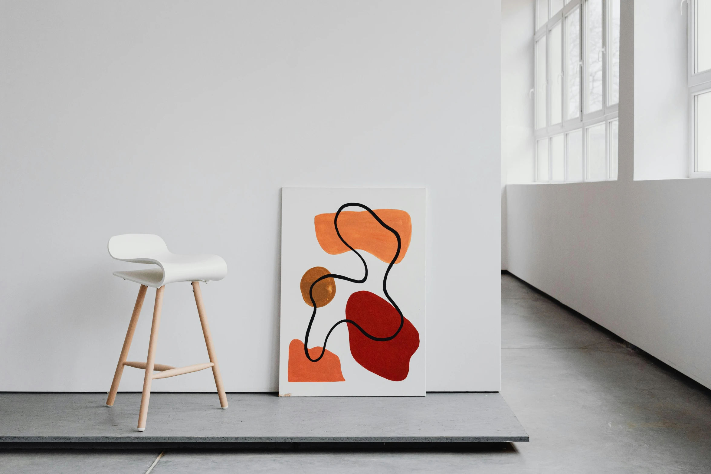 a white chair sitting next to a painting on a wall, a minimalist painting, inspired by Josse Lieferinxe, unsplash contest winner, red and orange colored, organic lines, trending on dezeen, canvas art print