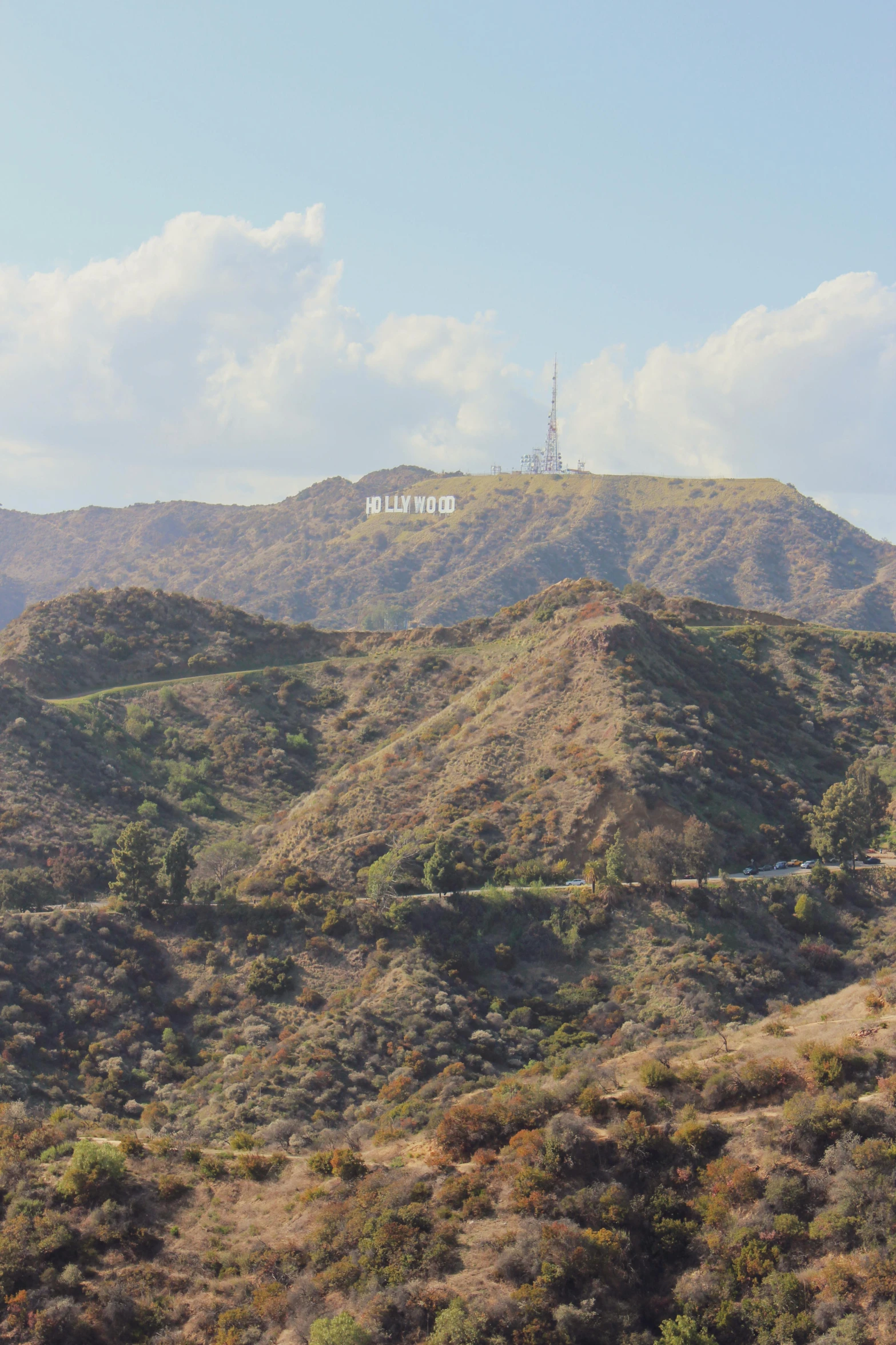 a view of the hollywood sign from the top of a hill, ziggurat, looking partly to the left, in 2 0 1 5, exterior