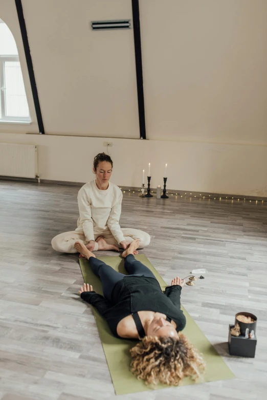 a couple of people sitting on top of a yoga mat, a picture, by Jan Tengnagel, renaissance, wētā fx, low quality photo, comforting, spa