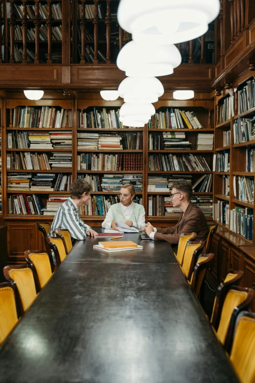 a group of people sitting around a table in a library, alexandra fomina, slightly minimal, jugendstill, rubens