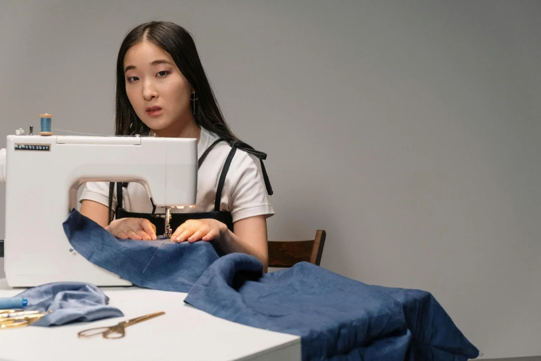 girl with her sewing machine and cloth under it