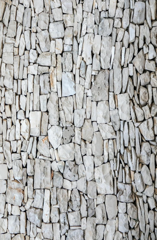 a fire hydrant in front of a stone wall, inspired by Andreas Gursky, minimalism, ((rocks)), insanely detailed, stacked, delicate patterned