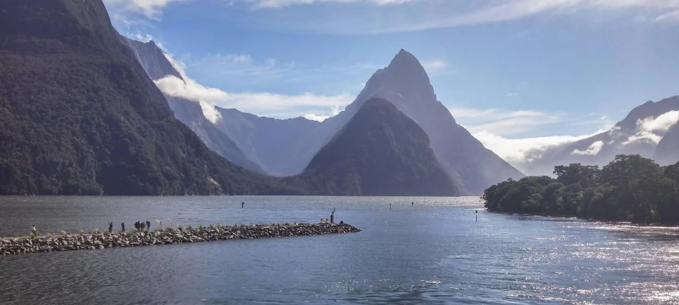 a body of water with mountains in the background, middle earth, tourism, grey, general