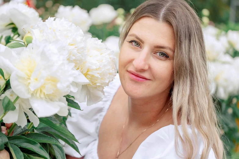 a woman holding a bunch of white flowers, inspired by Anna Findlay, pexels contest winner, relaxed eyebrows, peony, olya bossak, avatar image