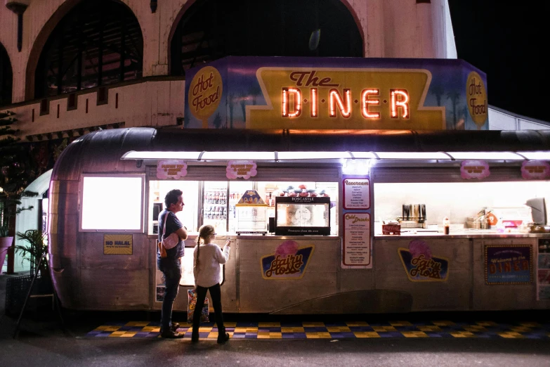 a couple of people standing in front of a food truck, by Dan Frazier, pexels contest winner, neon lights outside, in classic diner, little kid, dinner is served