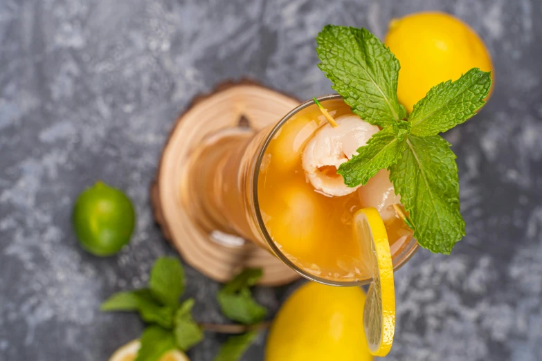 a close up of a drink with lemons and mint, a portrait, by Matthias Stom, trending on pexels, hurufiyya, scorpion tail, thumbnail, mango, high definition image