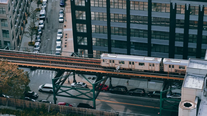 an elevated train on the tracks near buildings