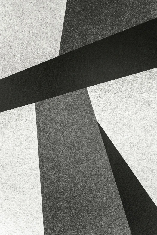 a black and white photo of a building, an abstract drawing, inspired by Alexander Rodchenko, unsplash, suprematism, textured paper, detail shot, carpeted floor, cross