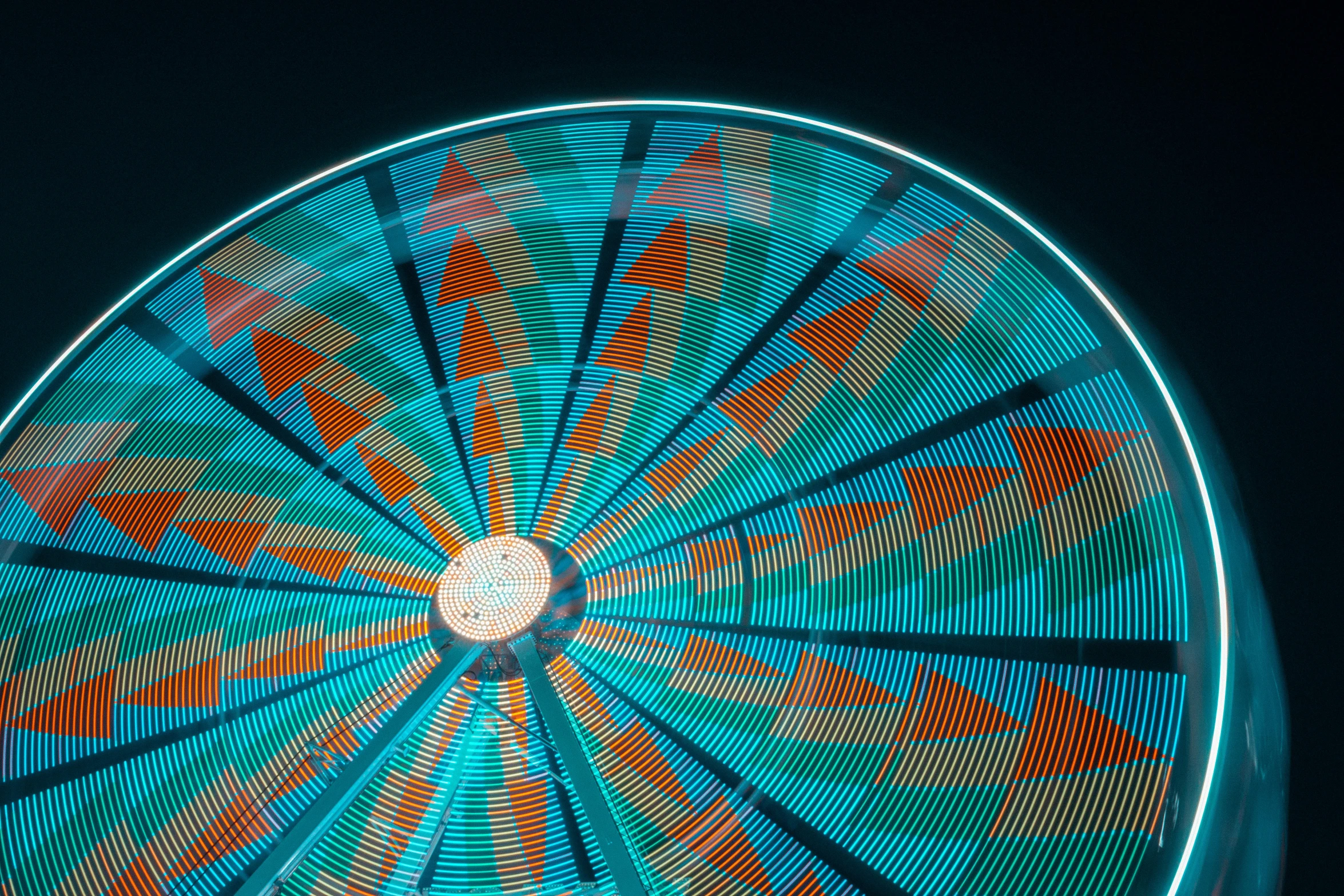 a close up of a ferris wheel at night, a portrait, by Carey Morris, pexels contest winner, interactive art, orange and cyan paint decals, geometrically realistic, new mexico, luminescent fabrics