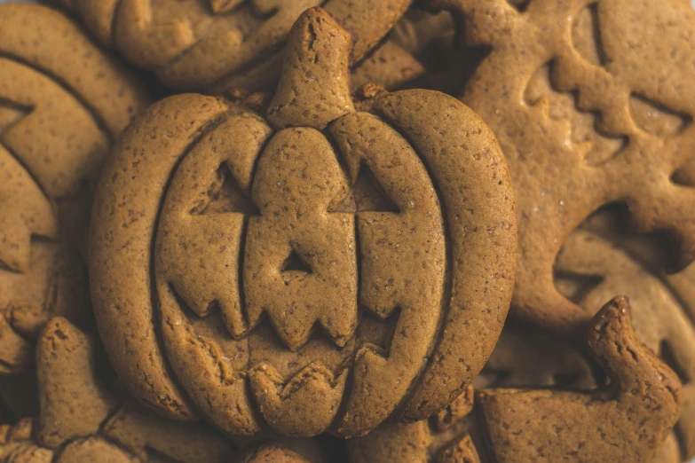 a close up of a plate of cookies, by Emma Andijewska, pexels, jack - o'- lantern, background image, alessio albi, detailed high resolution