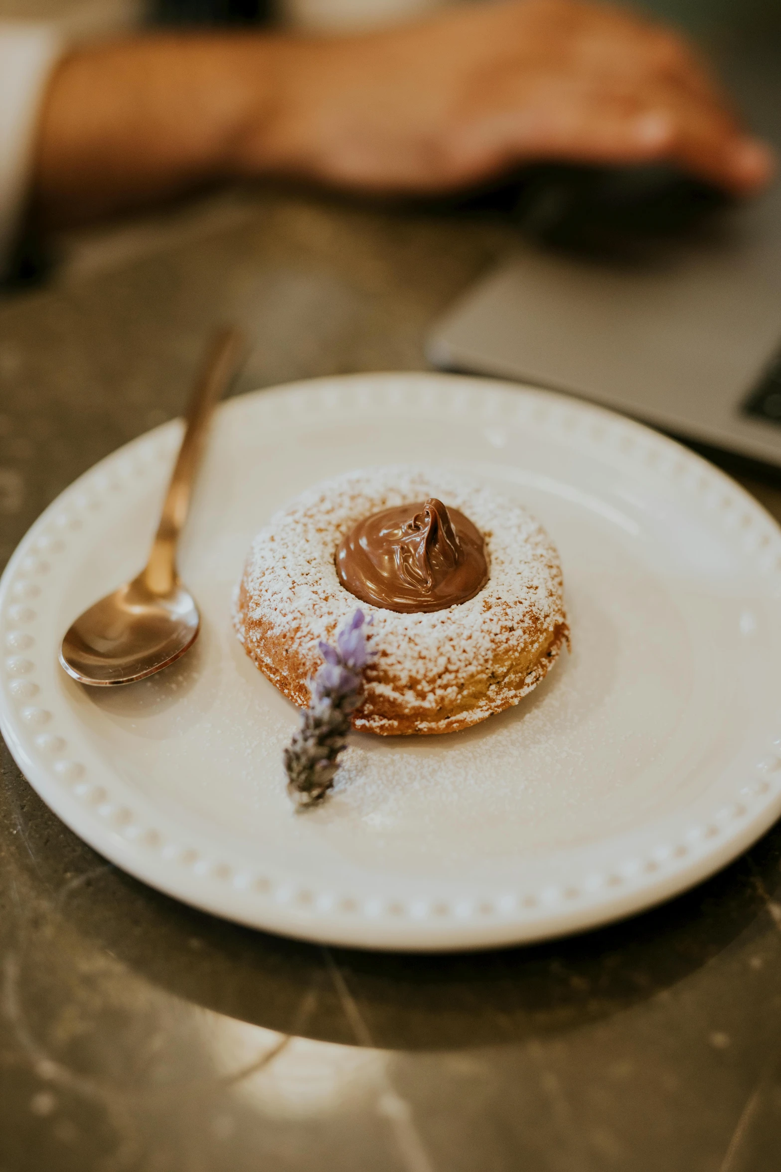 a white plate topped with a pastry next to a laptop, inspired by Richmond Barthé, unsplash, romanticism, lavender, 2 5 6 x 2 5 6 pixels, blender donut, bronze