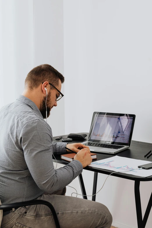 a man sitting at a desk using a laptop computer, trending on pexels, connecting lines, video, ilustration, studious